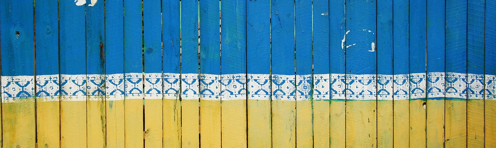 A Fence in Ukraine Painted in the Colors of the Ukrainian Flag