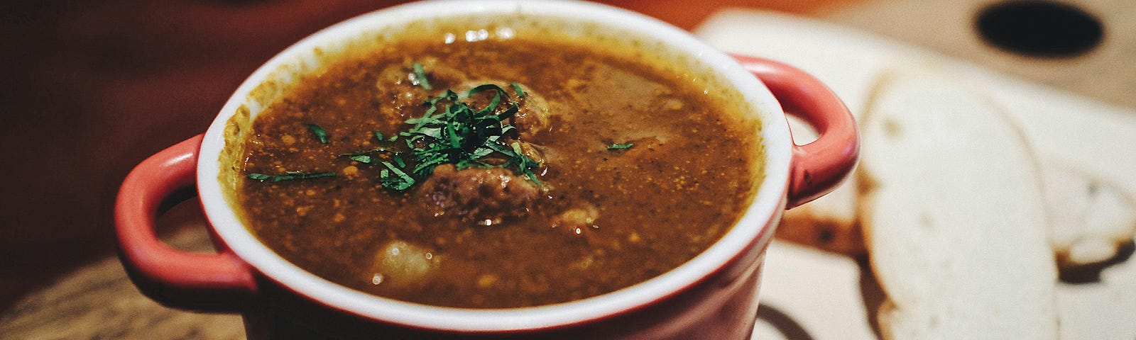 A large and rustic-looking bowl of soup