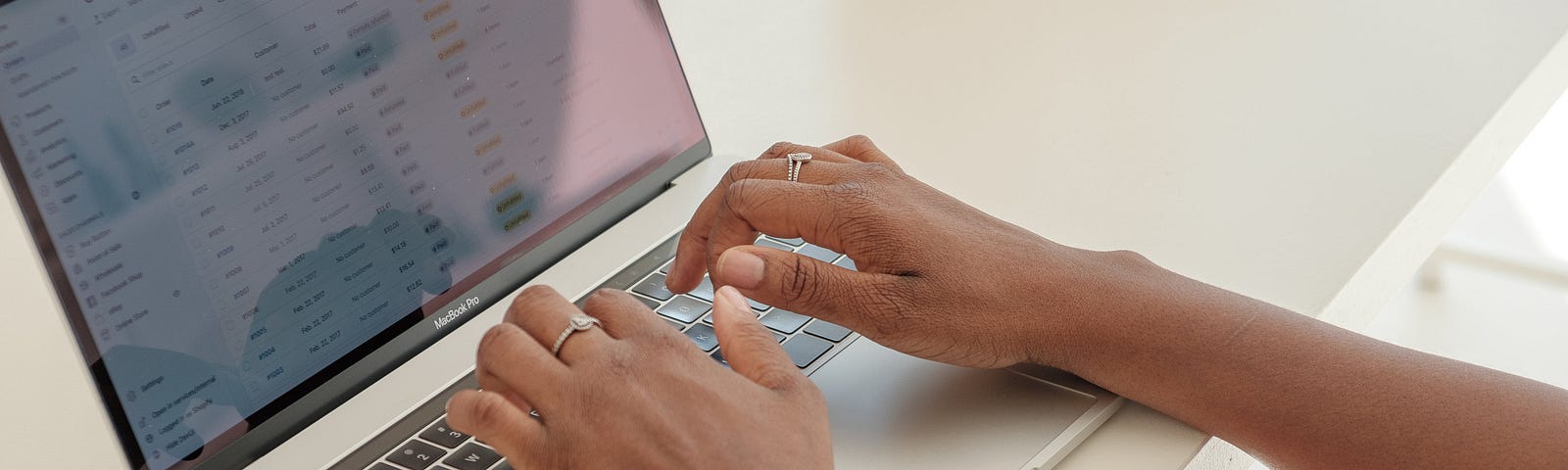 Hands typing on a Laptop