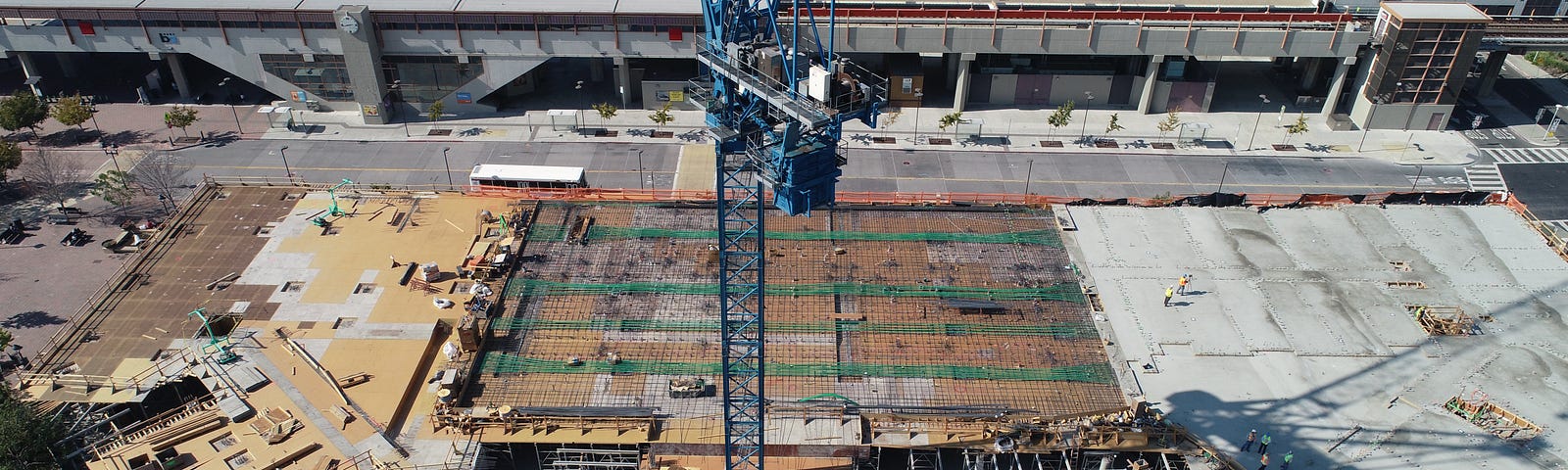 Framework, builders pouring concrete.