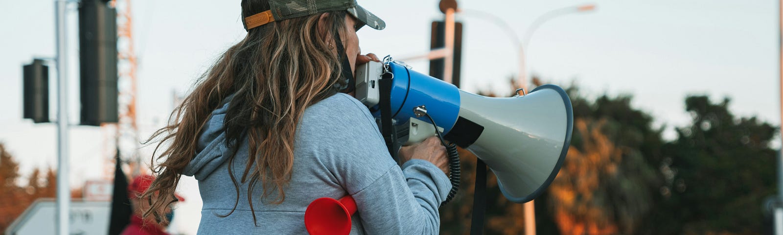 This shows a woman with a bullhorn.