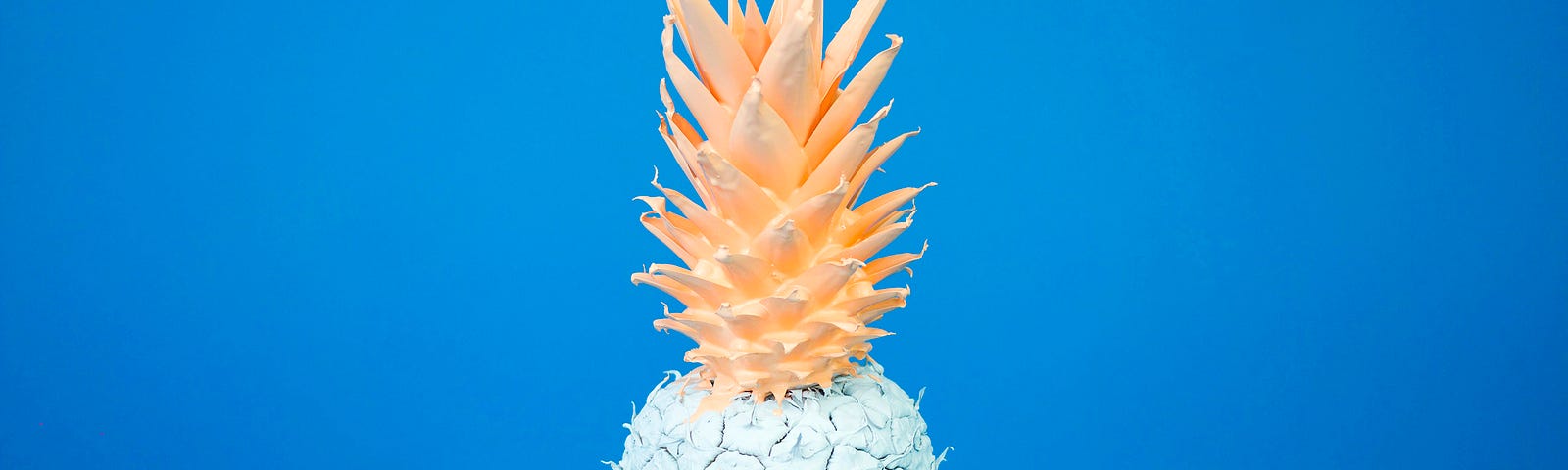 pineapple painted in blue and golden