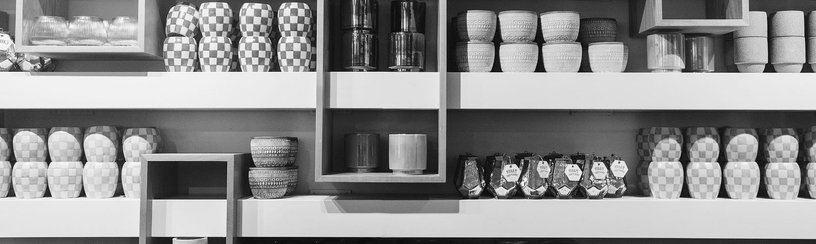black and white image of a cabinet full of stuff