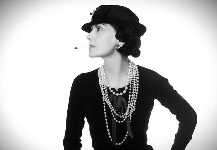 Coco Chanel smoking a cigarette. (Source: link).