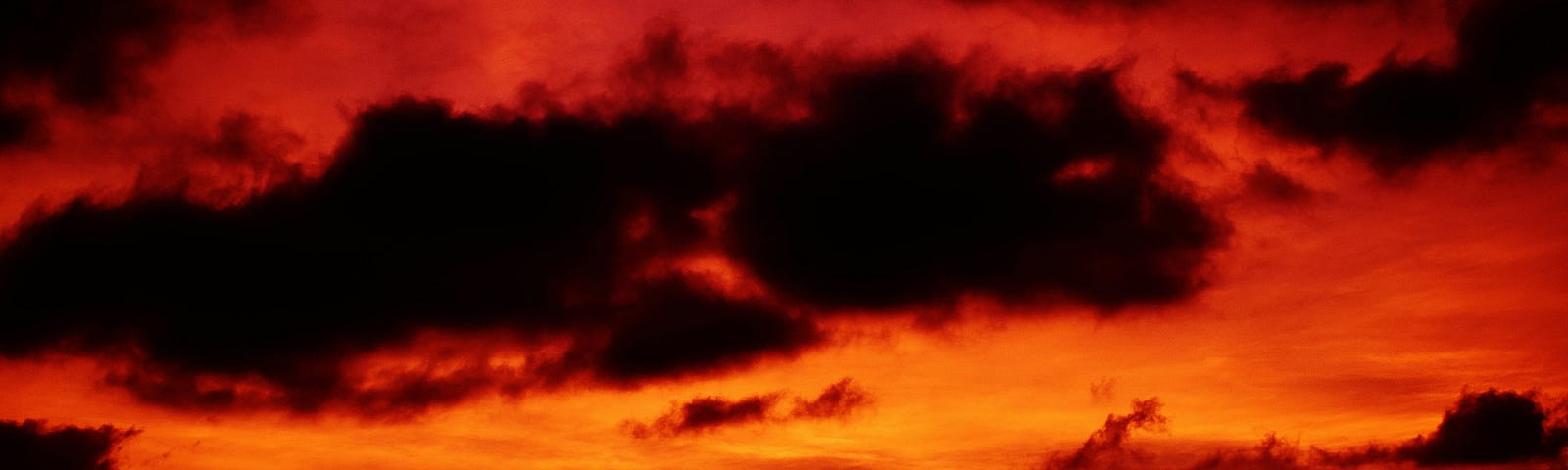Black clouds in a red sky, indicating impending doom.