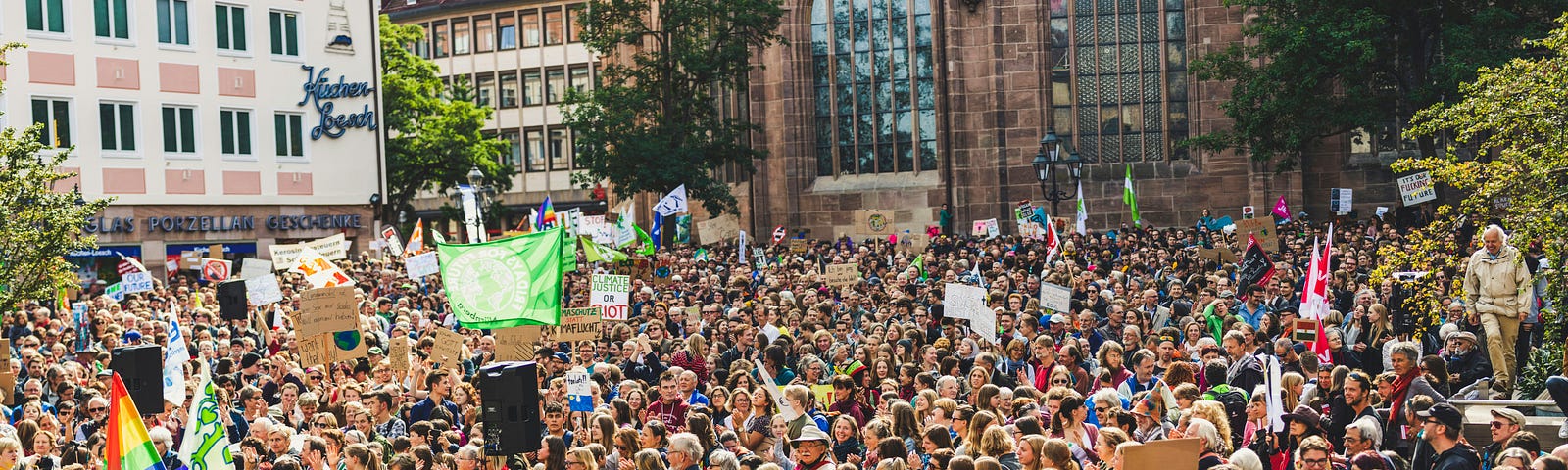 A large crowd of protesters in daylight.