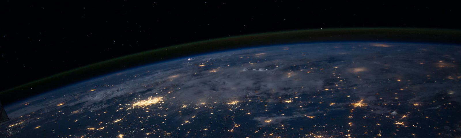 Earth as viewed from above, with sparks of light where electricity is gathered, looking like a network map