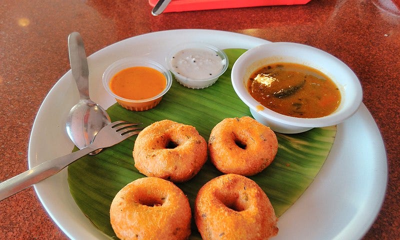 Medu vada is a very popular South Indian dish. It is made of fried ground lentils and is usually served accompanied with sambar and coconut chutney.