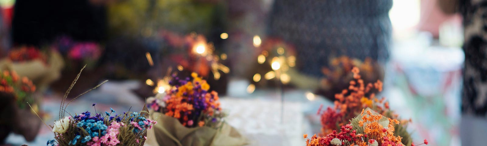 A table with little pots of flowers