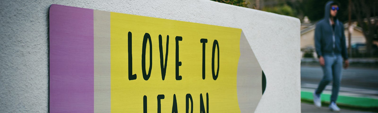 LOVE TO LEARN SIGN. Reirrating the importance to always learn