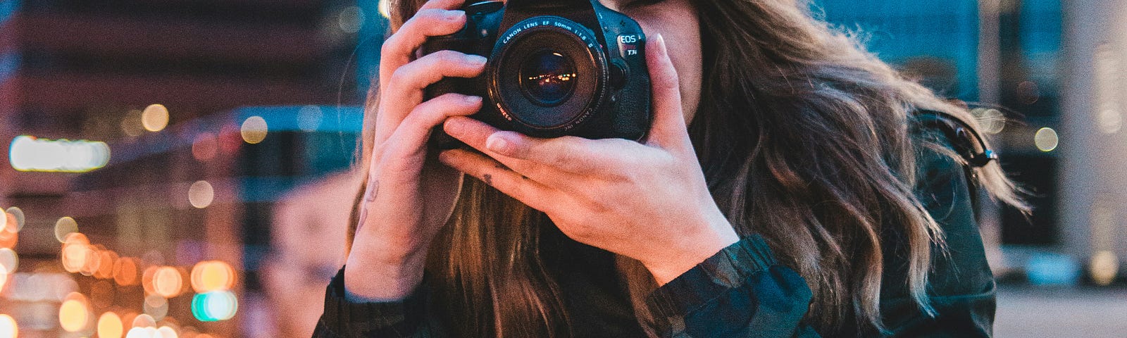 pic of young lady taking photos with her camera