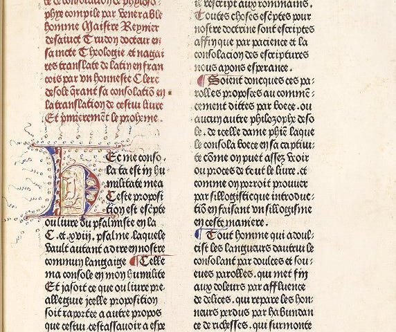 A page of text in two columns in which the first few lines are rubricated and the first column contains an illuminated initial.