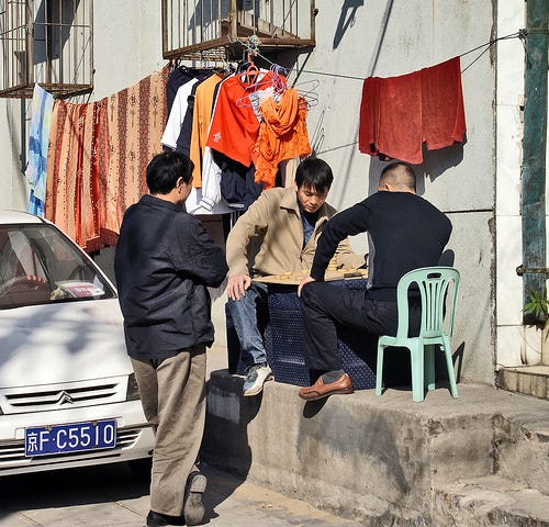 A street side game of mah-jongg. (CC BY-NC-ND Aurelio.Asaian via Flickr)