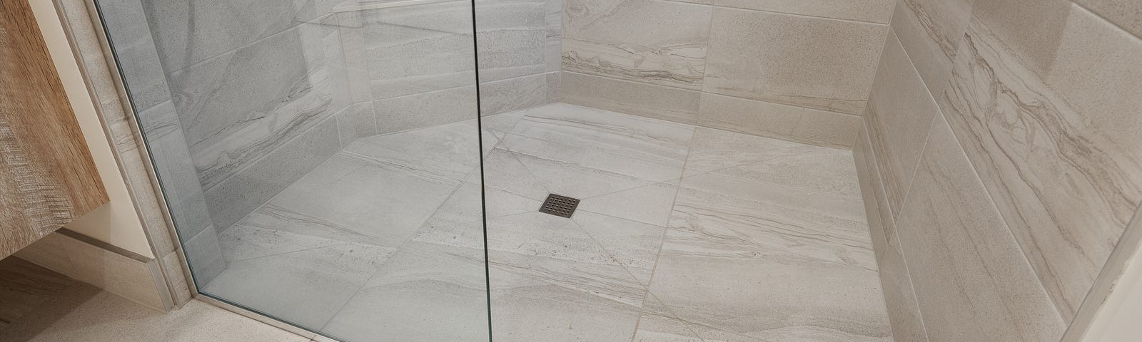 The floor and drain of a walk-in shower