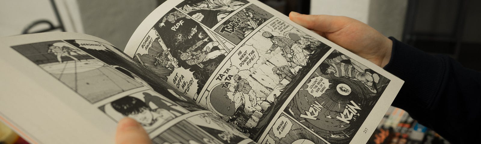 A person reading the manga Akira