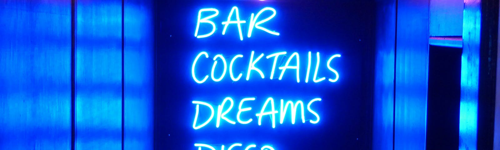 Neon sign in a bar, cocktails, dreams, disco party