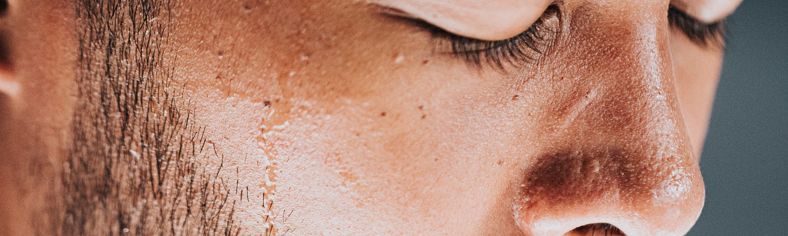 man with sweat on forehead