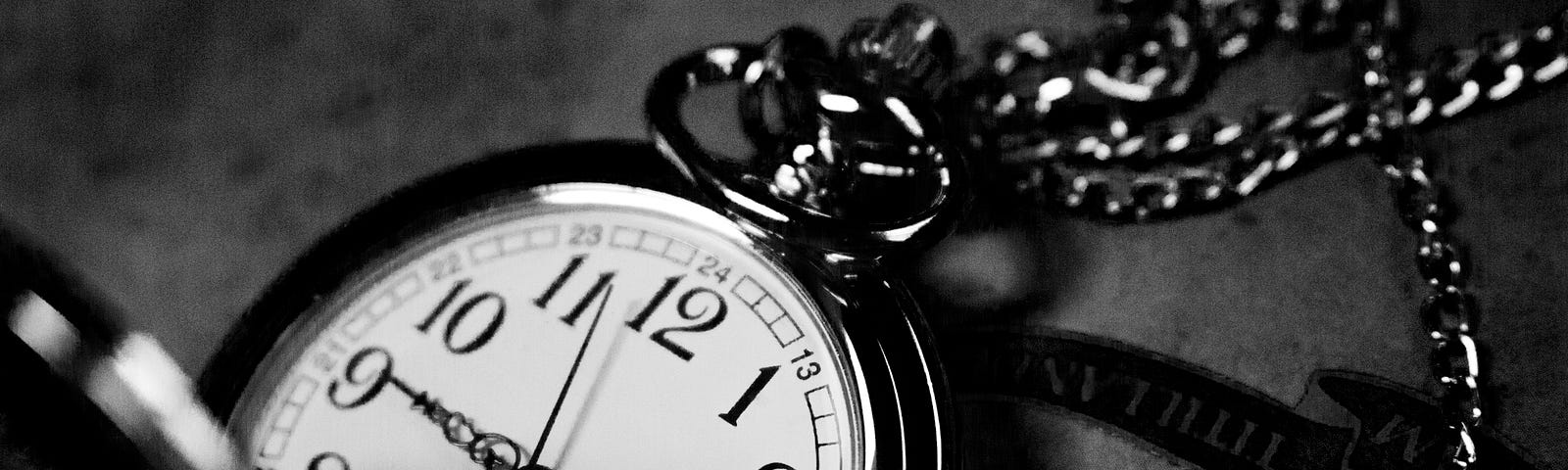 black and white picture of a pocket watch