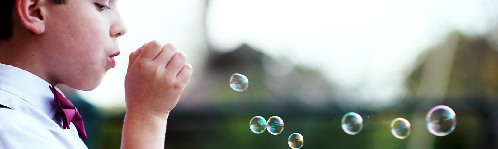 Blowing bubbles.