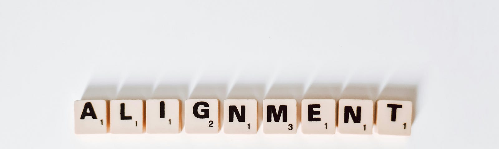 The word ‘ALIGNMENT’ in scrabble letters