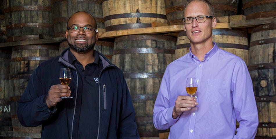 Hiram Walker Distillery warehouse supervisor Donald Campbell (L) and Master Blender Dr. Don Livermore (R) in one of the 16 maturation warehouses at the distillery's warehouse campus near Windsor, Ontario. Photo ©2017, Mark Gillespie, CaskStrength Media.