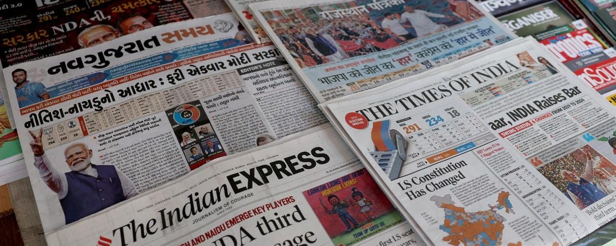 Newspapers displayed at a roadside stall following the results of India’s general election, in Ahmedabad, India, June 5, 2024. Photo by Amit Dave/Reuters