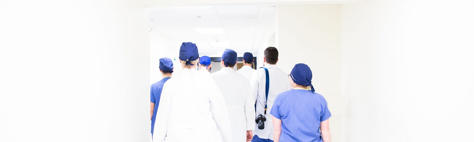 healthcare workers walking down a hall
