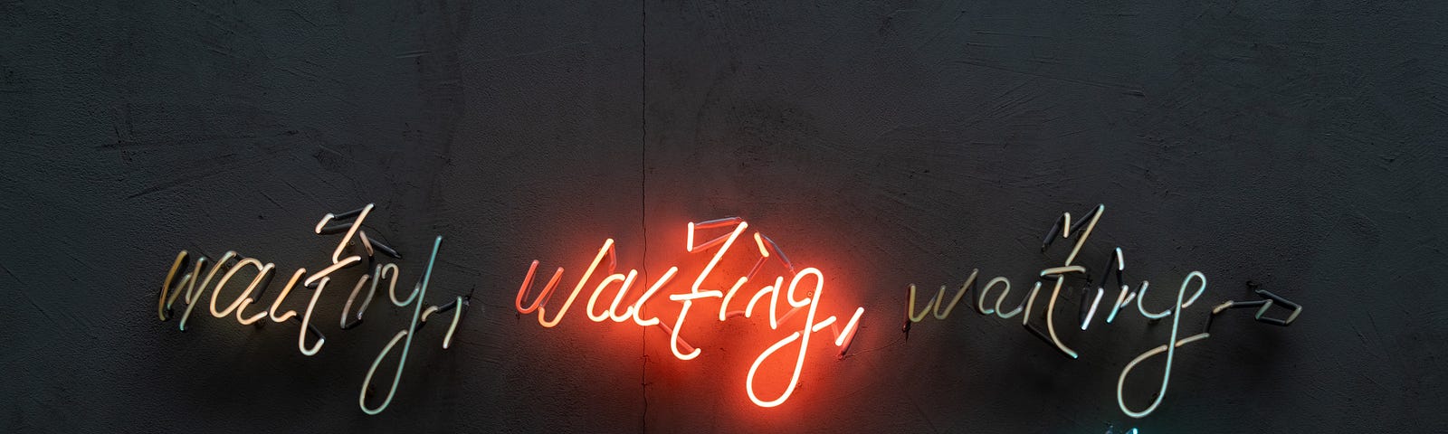 Multiple neon signs with “waiting” lit up