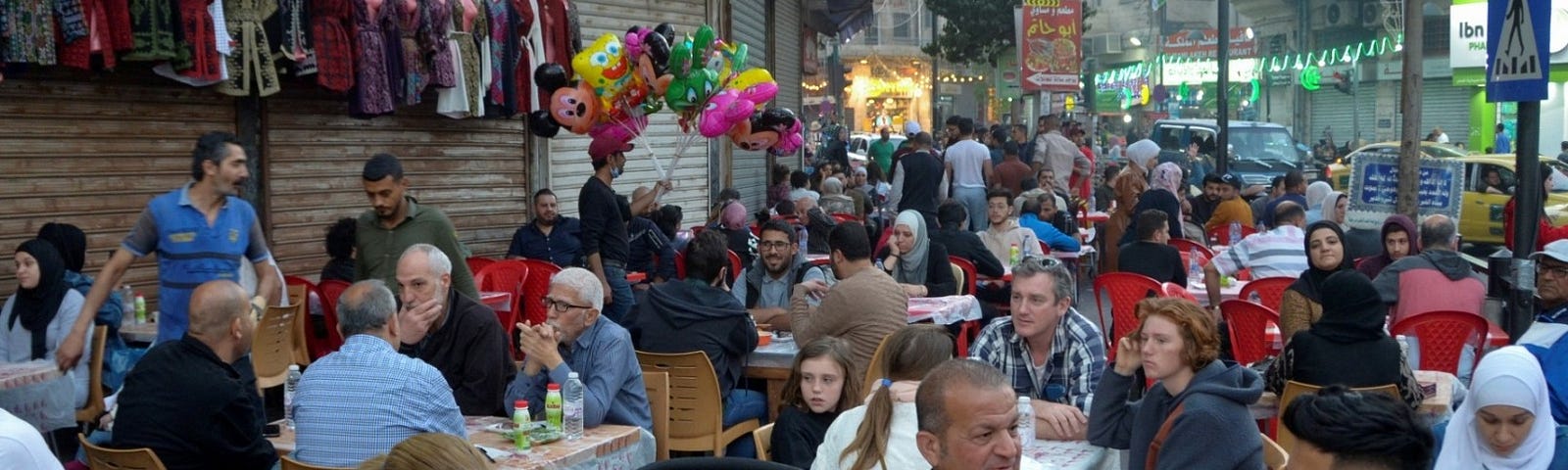 People wait to have their Iftar meals during the holy month of Ramadan in Amman, Jordan, April 9, 2022. Photo by Muath Freij/Reuters