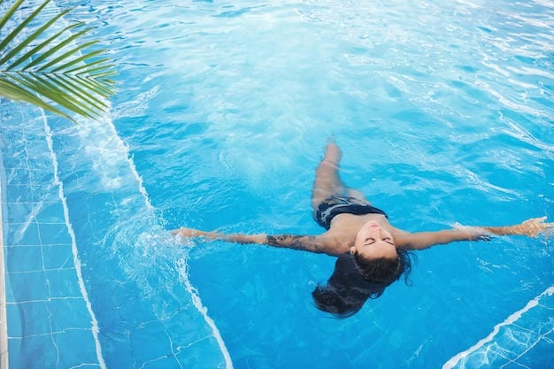 Young woman relaxing in swimming pool