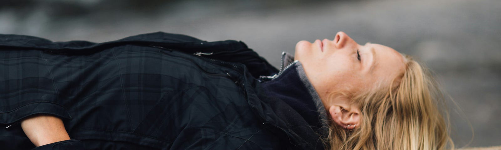 woman lying on a tree taking a nap and resting