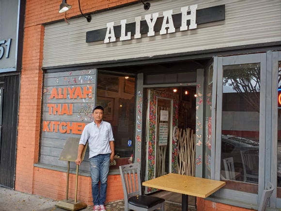 Man standing outside Aliyah Thai Restaurant, Pasadena, CA