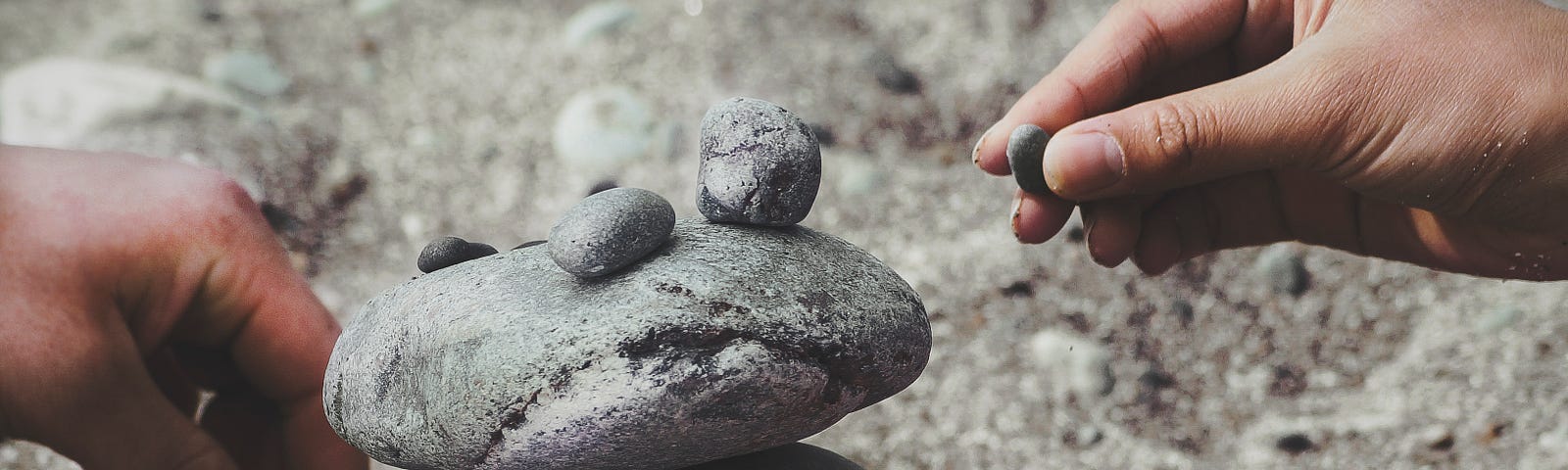 Placing stones on top of each other to form a stack