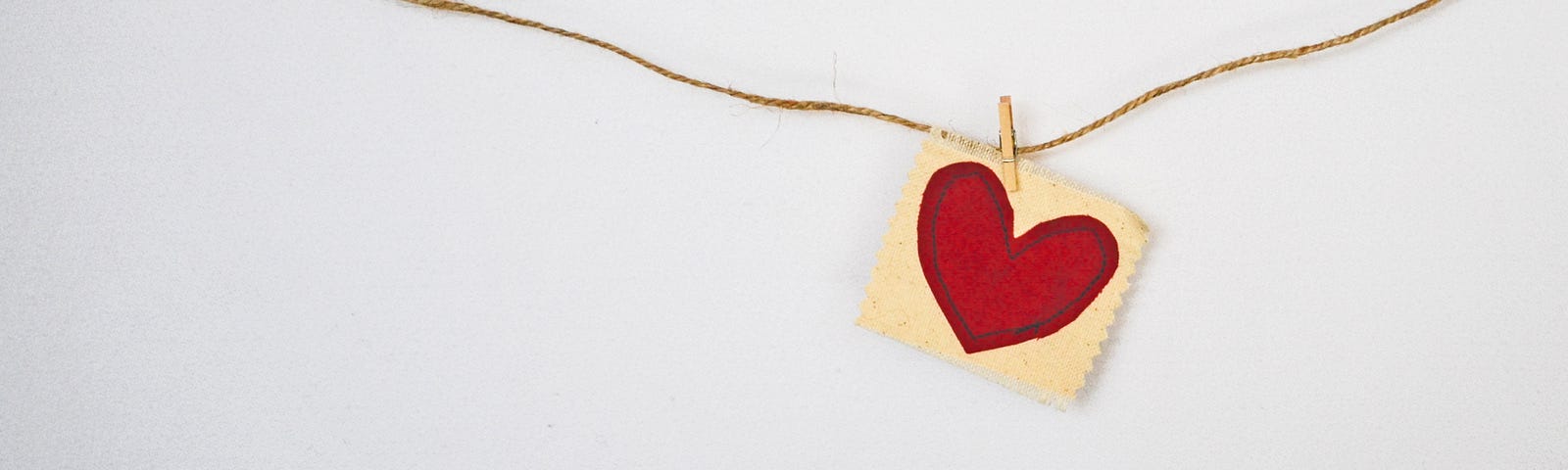 A red heart on pale yellow paper is clipped to a string. Adopting heart-health habits can lead to clinically significant weight loss. A healthy diet combined with more exercise can promote weight loss. On the other hand, skipping meals and using prescription diet pills do not appear to improve long-term weight.