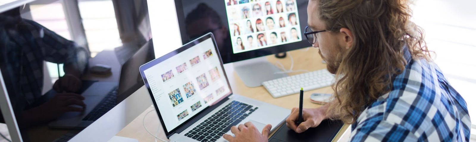 a UX designer sitting in front of a computerr