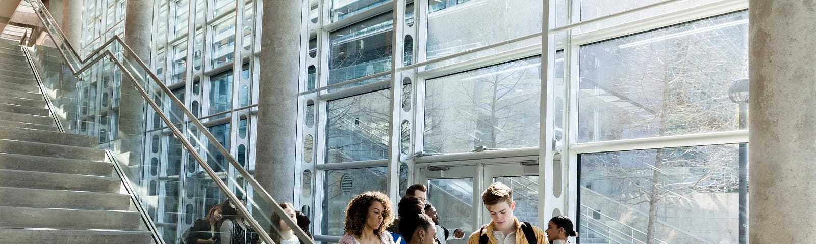 College building lounge with group of students. Photo by SDI Productions/Getty Images