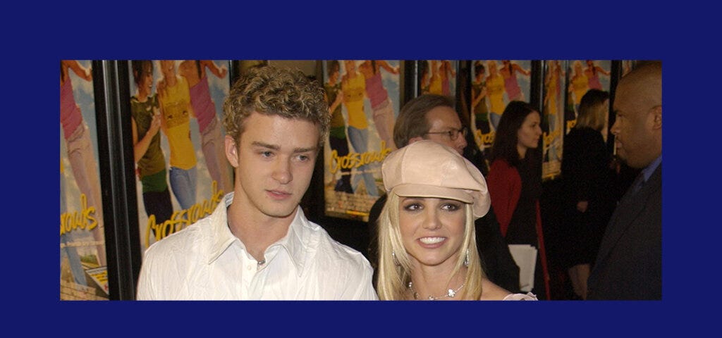 A photo of Justin Timberlake and Britney Spears on a red carpet prior to their breakup in 2002