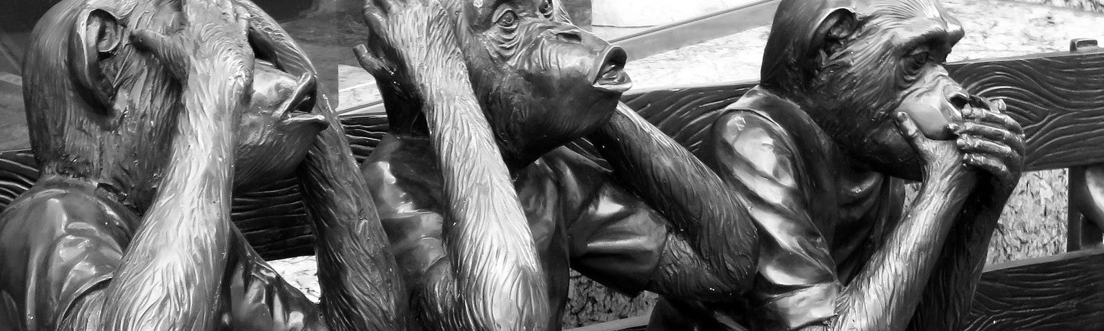 Three ape statues see no evil, hear no evil, speak no evil