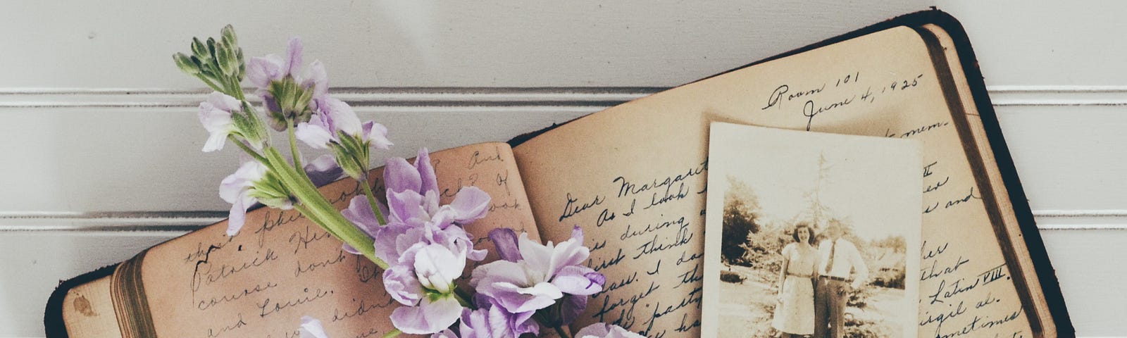 handwritten journal with flowers and an old photo