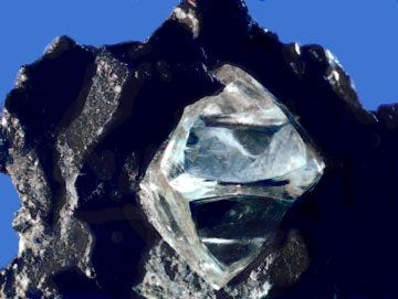 An uncut diamond in its matrix