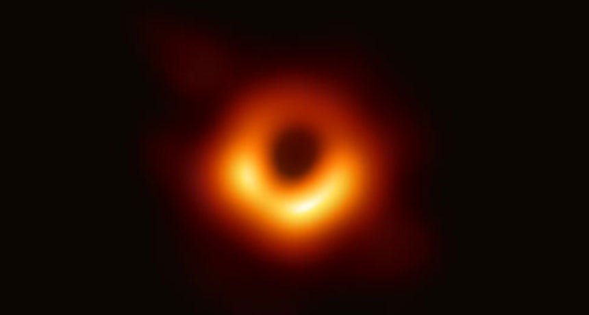 The first photograph of a black hole. It looks like a dark circle with a ring of light around it.