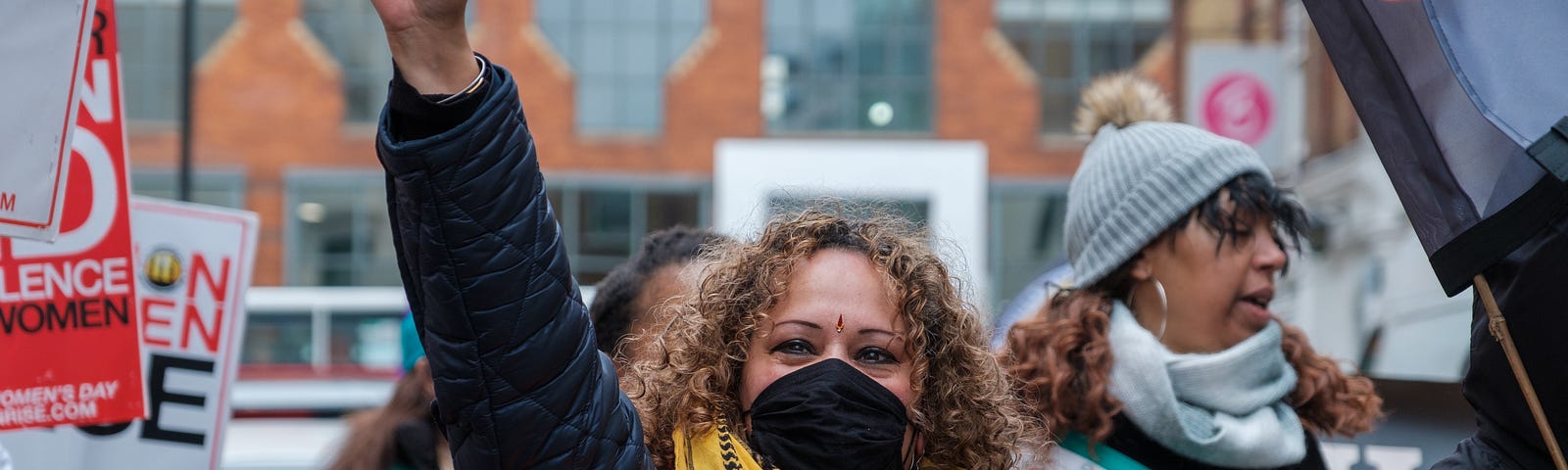 Woman protestor with fist raised