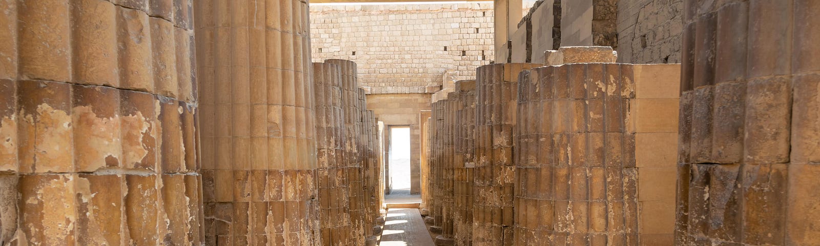 Entry through the ancient columns. The entrance gate of Pyramid of Djoser, Saqqara necropolis (near Cairo), Egypt