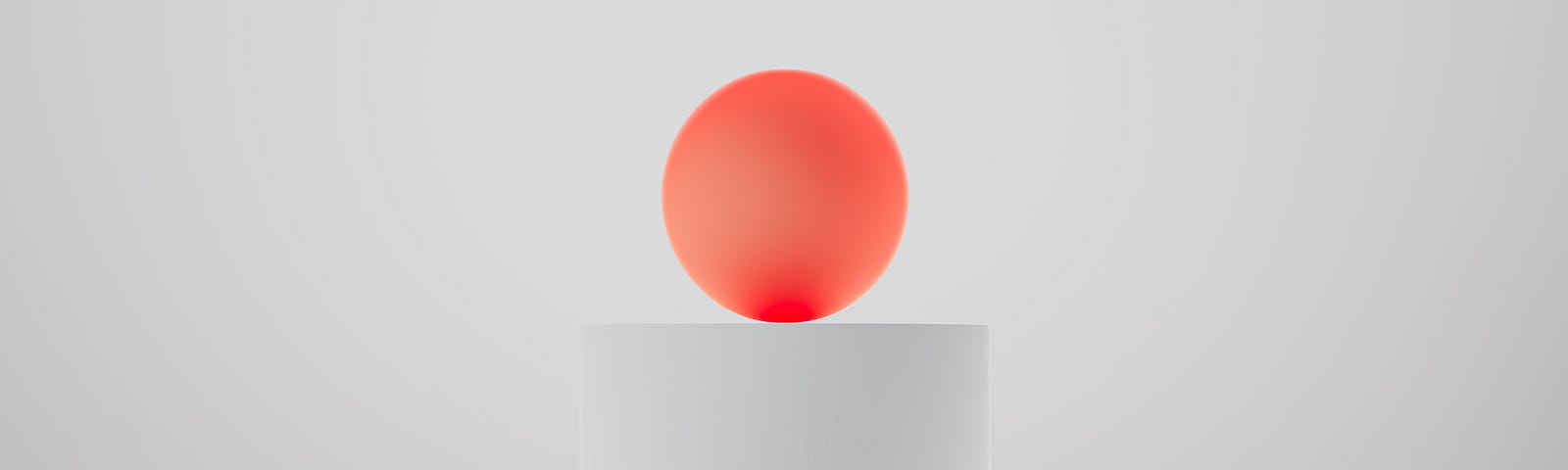 red ball on a white pedestal