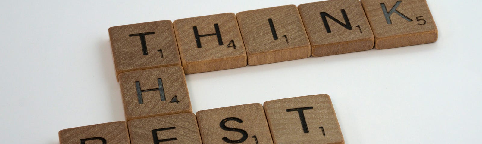 THINK THE BEST written on wooden blocks