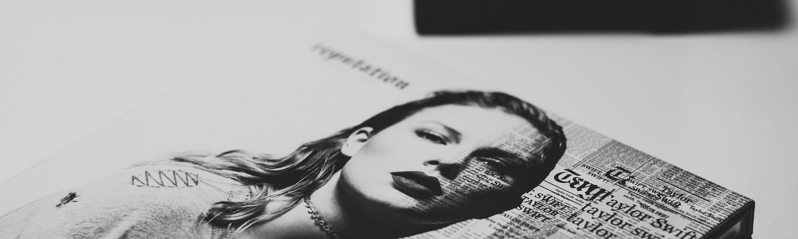 A black and white picture of Taylor Swift on the reputation album cover