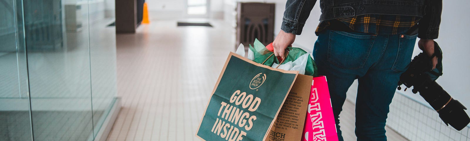 Image of a man carrying gift bags.