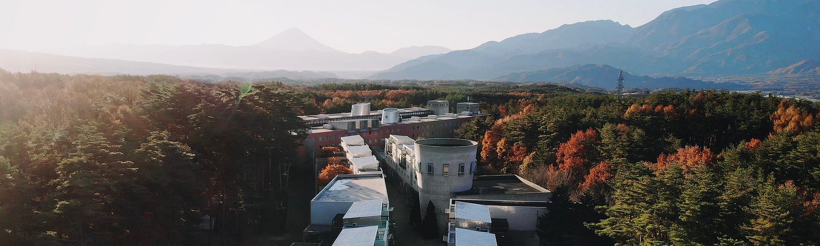 aerial photo of building in front of mountains