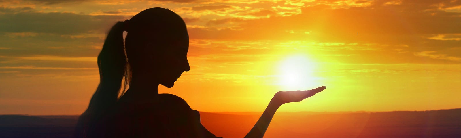 Photo of woman to look like she is holding the sun by Rampal Singh. Photo posted on Dr. James Goydos 2021 article ‘summer is here, is your skin safe’