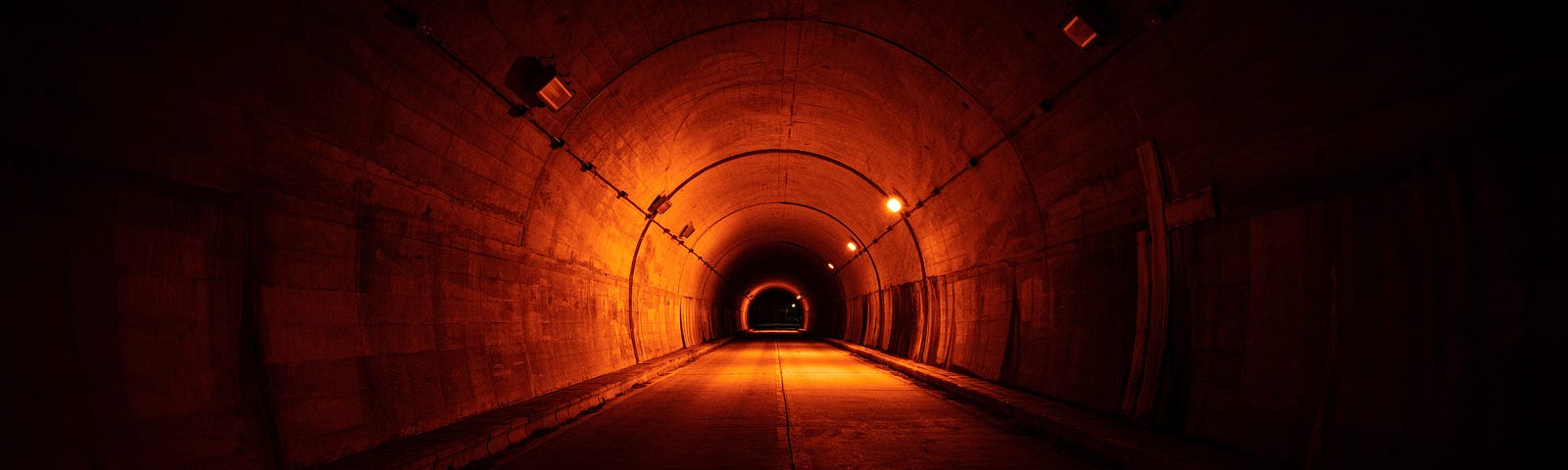 A concrete tunnel, dimly lit